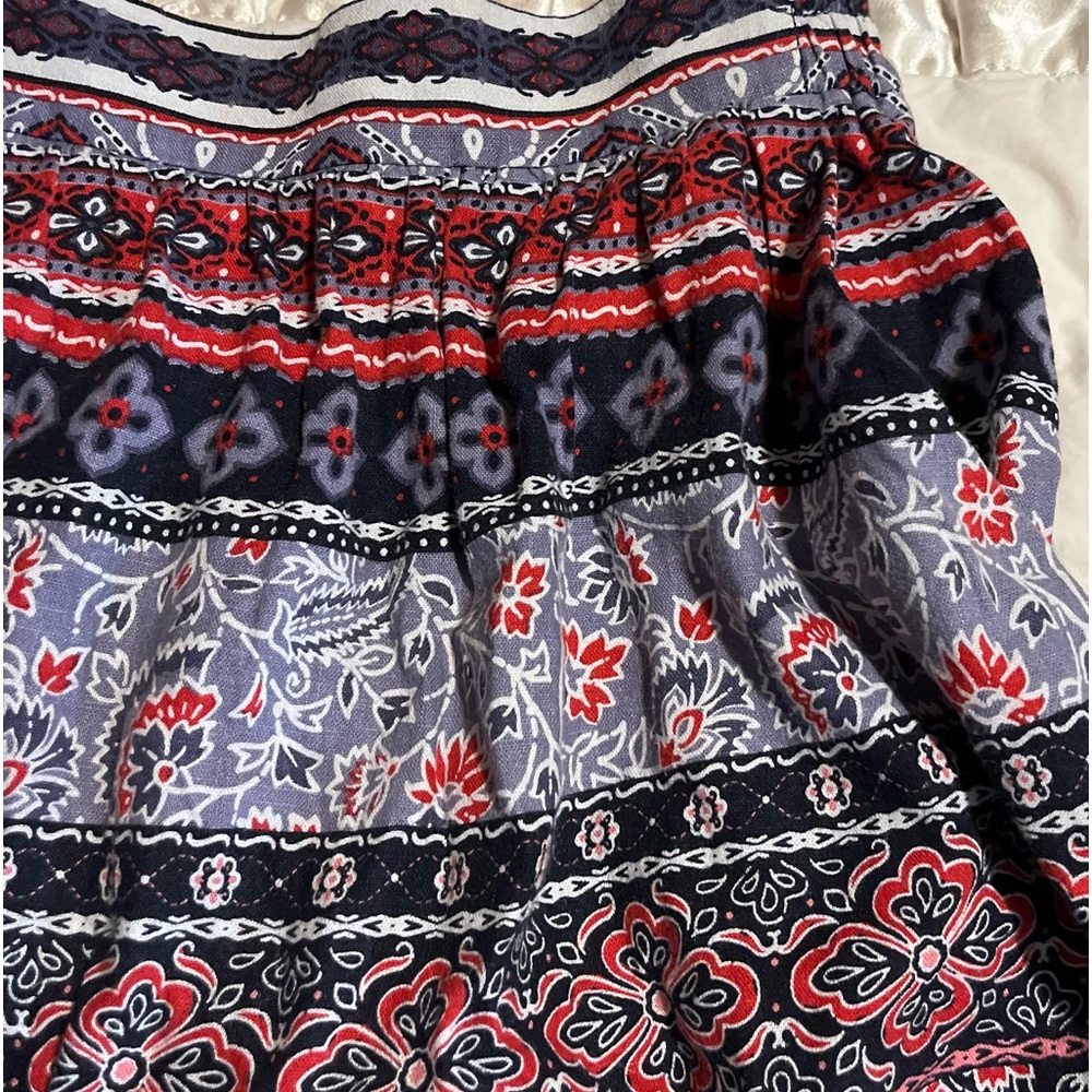 Loft skirt, XS. It is not petite, I am 5 ft and it fits me just to my knees.